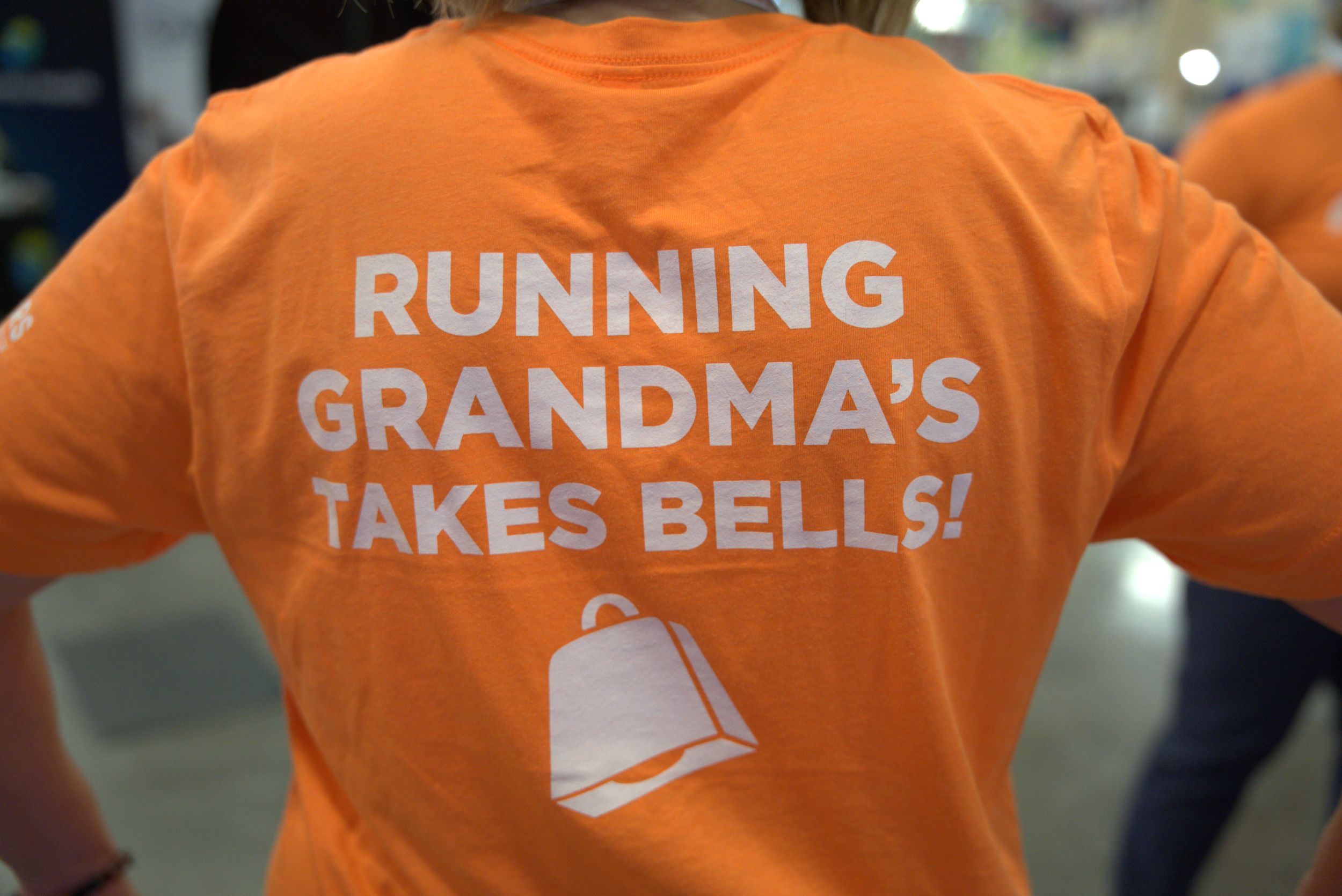 Running Grandma's Takes Bells! t-shirt - Members Cooperative Credit Union - Grandma's Marathon