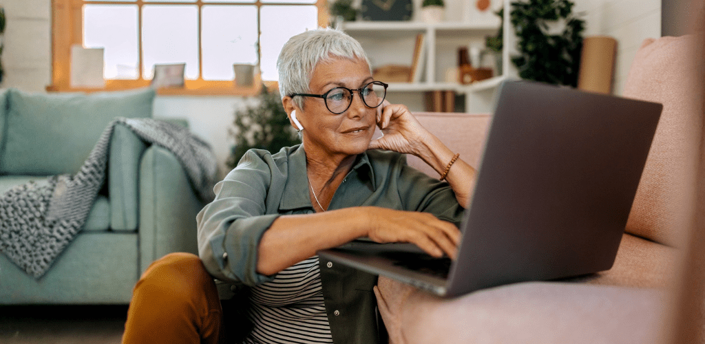 Person sitting down looking at their computer