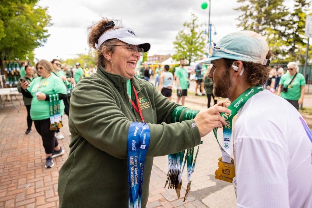 Chaz medaling a runner.