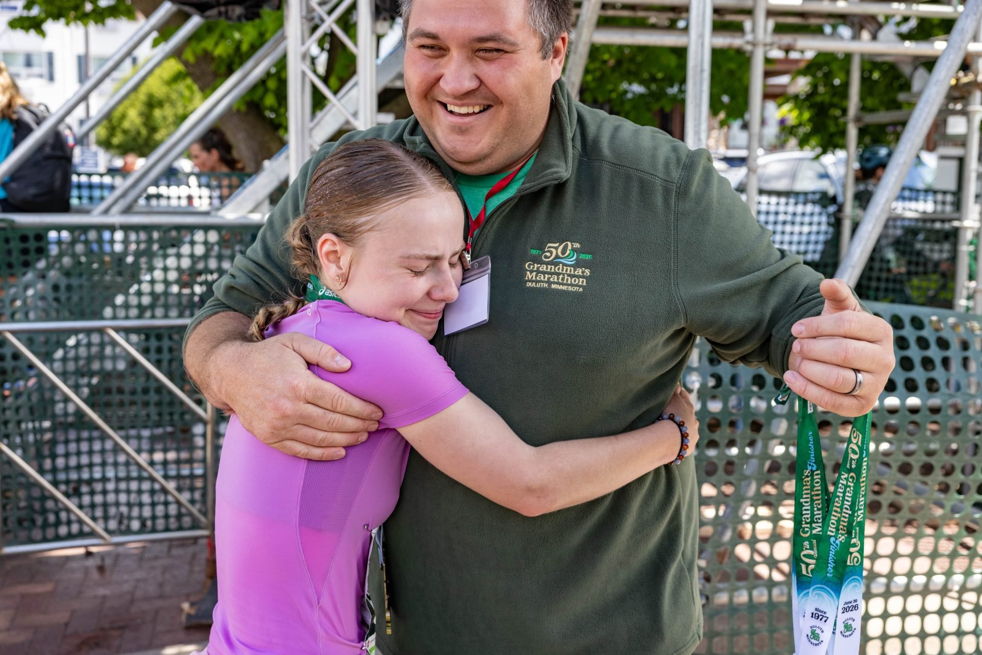Neil hugging Granma's finisher at the finish line.